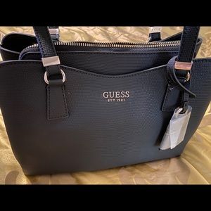 Brand new Black Guess handbag.